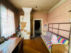 2-комнатная квартира в деревянном жилом доме в центре города