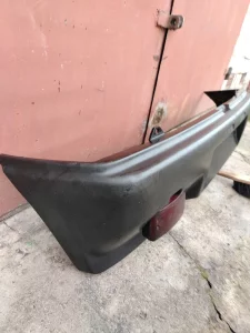 Бампер задний а/мобиля «Ока» с фонарём