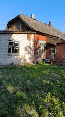 Долю в деревянном доме барачного типа