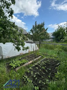 Часть дома с участком и гаражом в переулке Головача